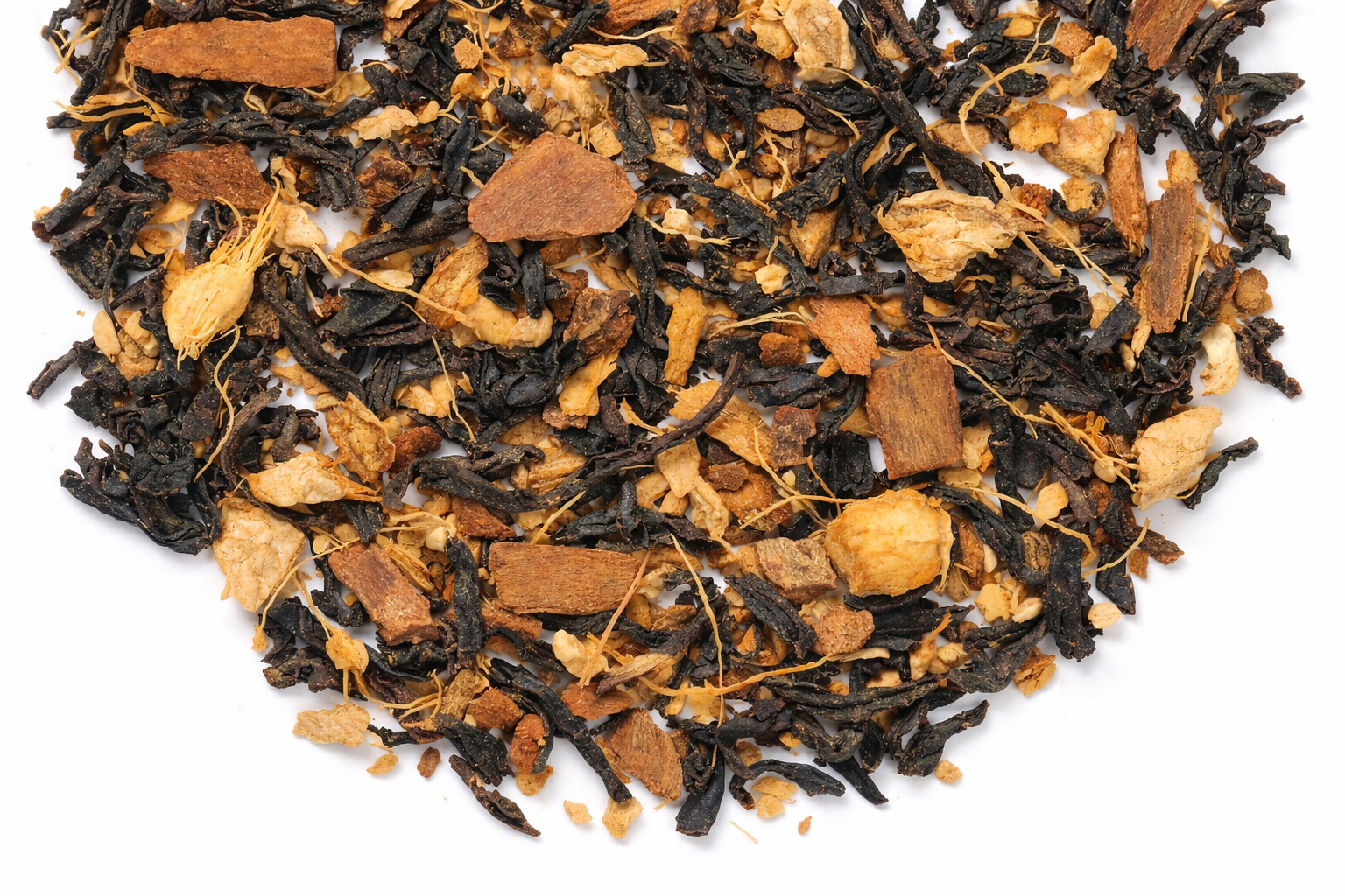 Close-up of a pile of black and amber-colored tea leaves on a white background