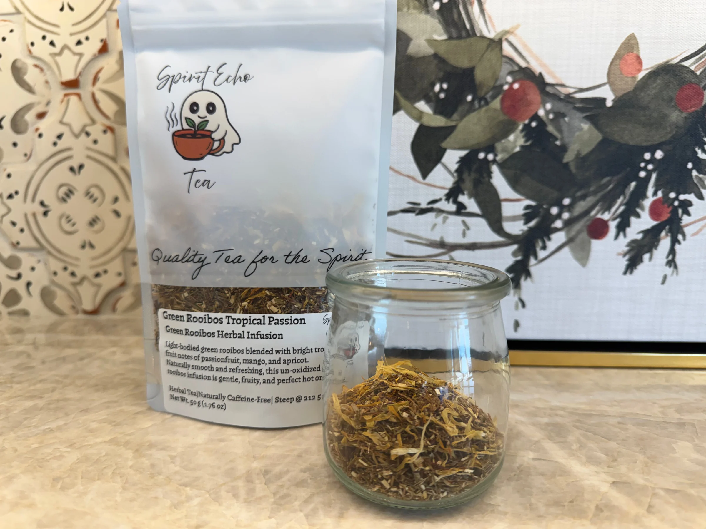 Tea packaging and glass jar with tea leaves on a decorative background