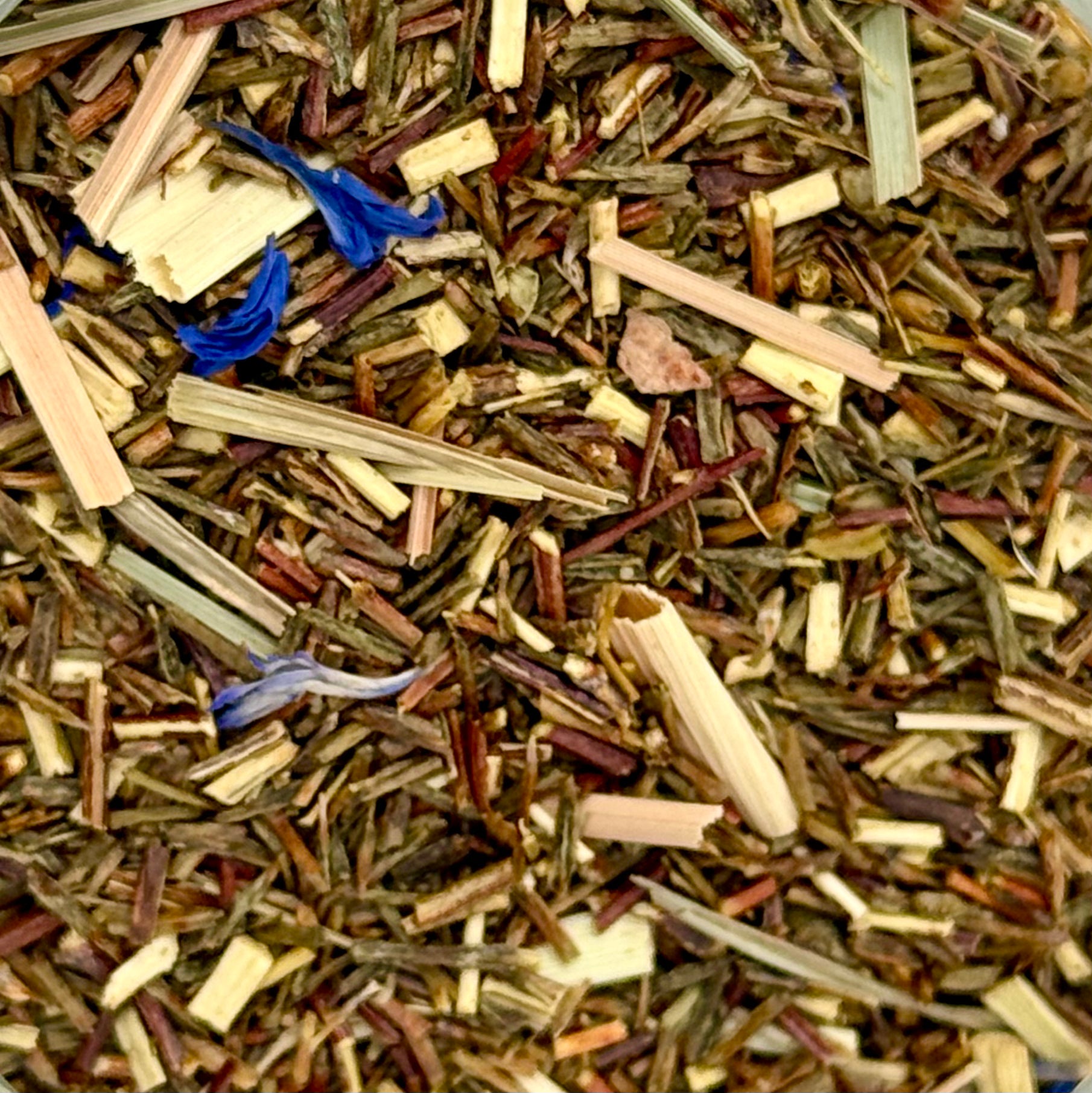 Close-up of a mix of dried herbs and flowers in various colors.
